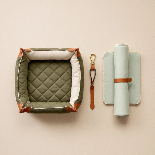 Larkwell The Motoring Set featuring an olive green quilted dog car bed, leather seatbelt tether, and cooling mat.