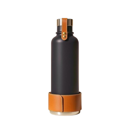 Larkwell insulated dog water bottle in charcoal with a tan leather sleeve, brass rivets, and magnetic steel bowl base.
