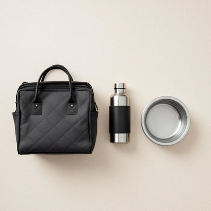 Larkwell The Long Weekend Set including a black quilted dog carrier, stainless steel flask, and collapsible bowl.