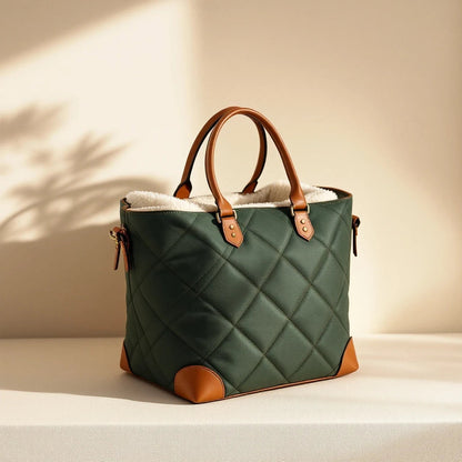Larkwell The Voyager forest green quilted dog carrier with cognac leather handles and soft teddy fleece lining