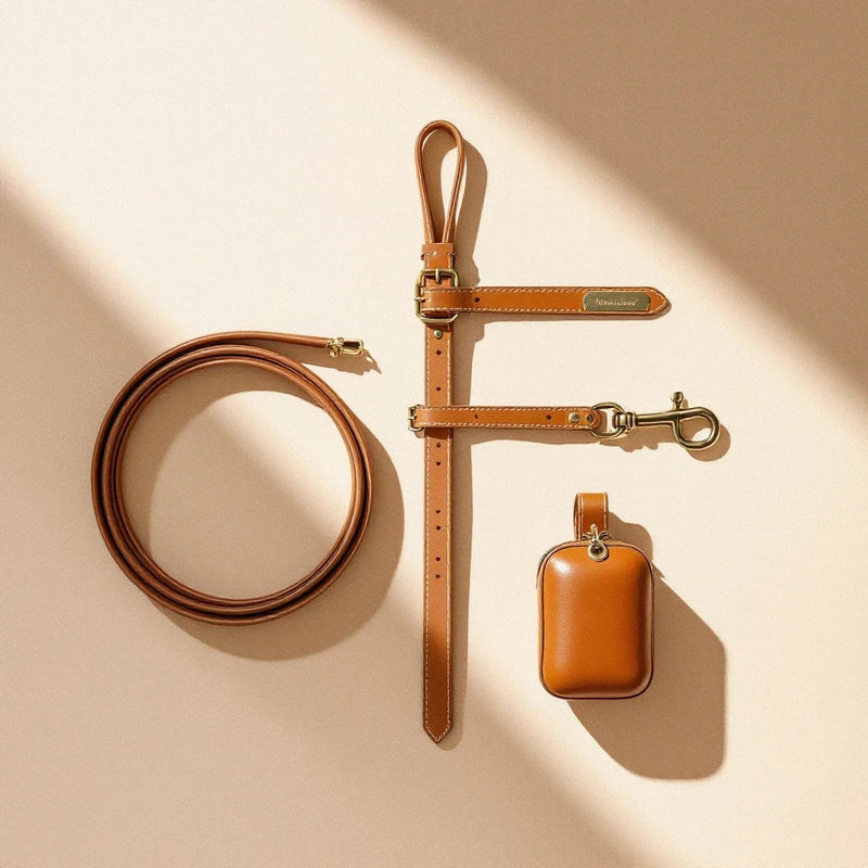 Larkwell The Heritage Set in chestnut tan leather featuring a dog collar, lead, and waste bag pouch with brass hardware