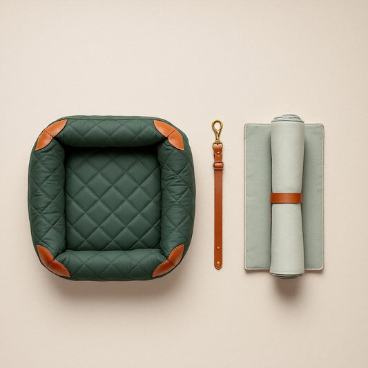Larkwell The Motoring Set including a green quilted dog car bed, leather seatbelt tether, and cooling field mat.