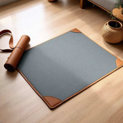 Larkwell slate grey linen cooling mat for dogs with chestnut tan leather trim and a matching leather travel strap.